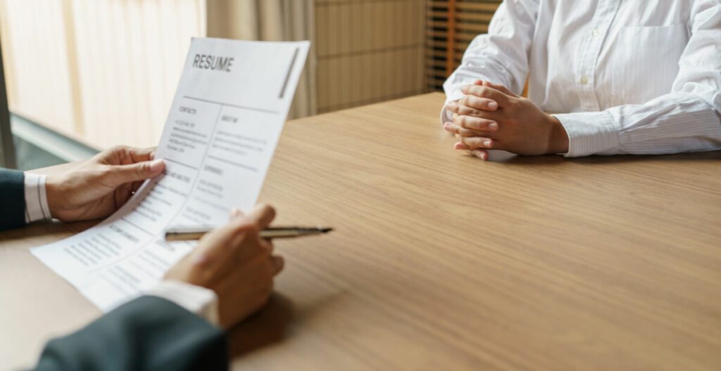 examiner reading a resume during job interview at 2023 07 17 22 59 50 utc